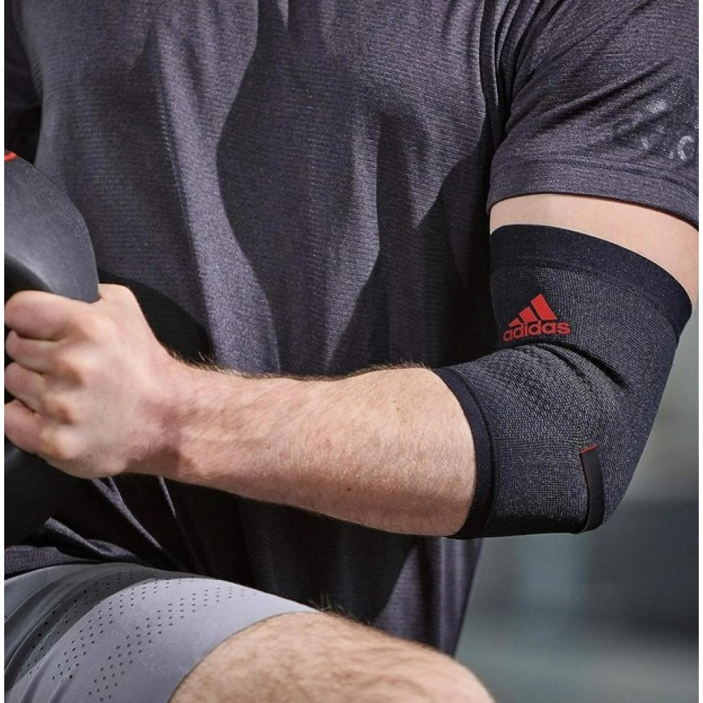 Фіксатор ліктя Adidas Performance Elbow Support чорний, червоний Уні S ADSU-13331RD