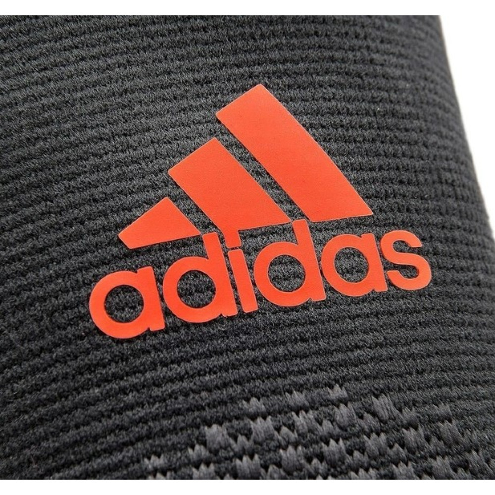 Фіксатор ліктя Adidas Performance Elbow Support чорний, червоний Уні M ADSU-13332RD