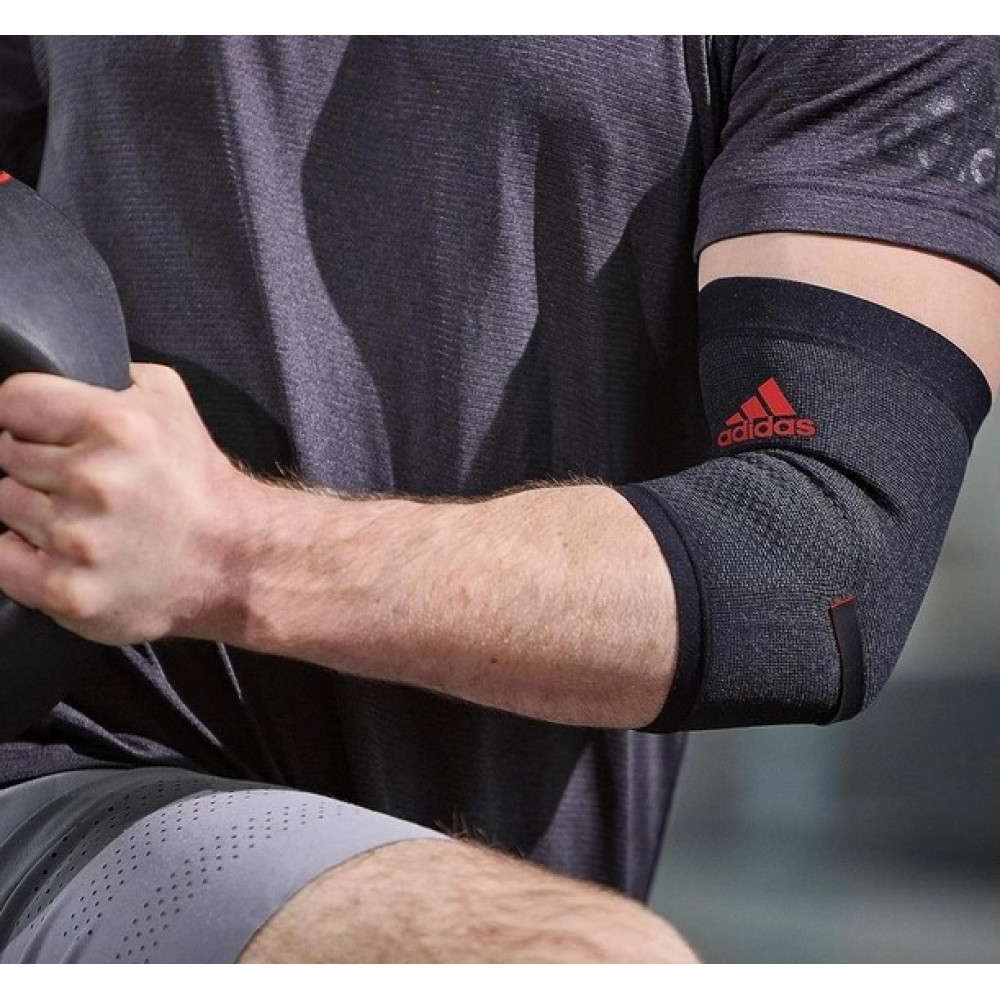Фіксатор ліктя Adidas Performance Elbow Support чорний, червоний Уні M ADSU-13332RD