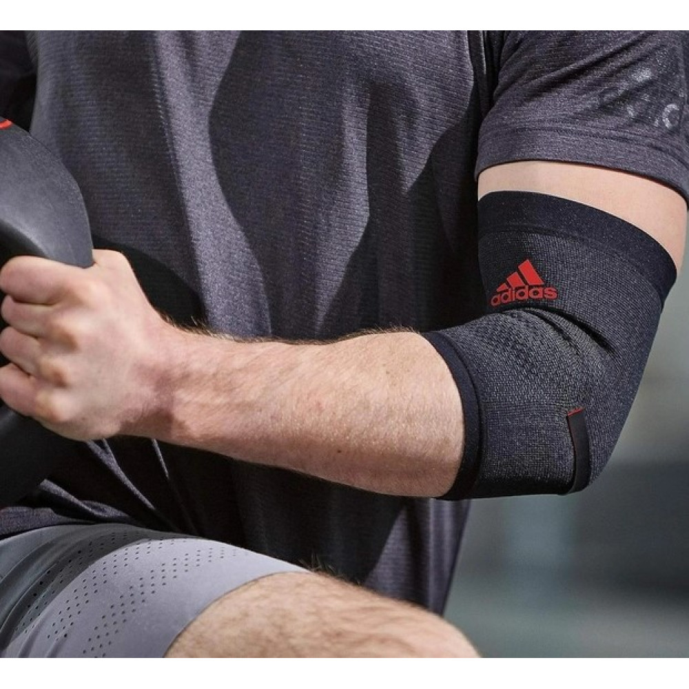 Фіксатор ліктя Adidas Performance Elbow Support чорний, червоний Уні L ADSU-13333RD