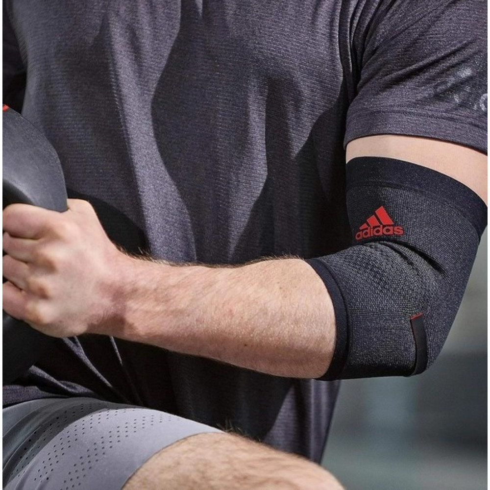 Фіксатор ліктя Adidas Performance Elbow Support чорний, червоний Уні XL ADSU-13334RD